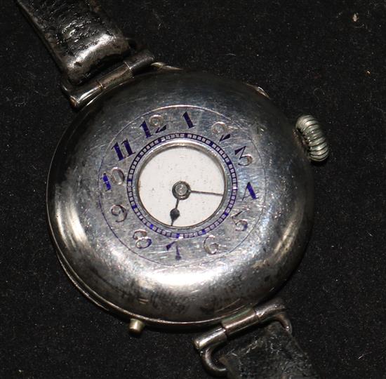 An early 20th century silver half hunter wrist watch.